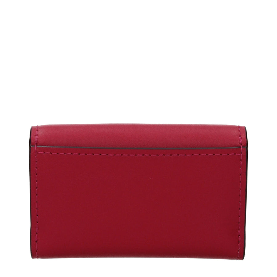 Red leather Michael Kors wallet with a silver padlock closure featuring the MK logo