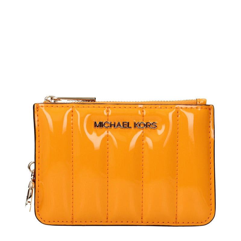 Bright orange quilted patent leather wallet with a top zipper and gold Michael Kors logo