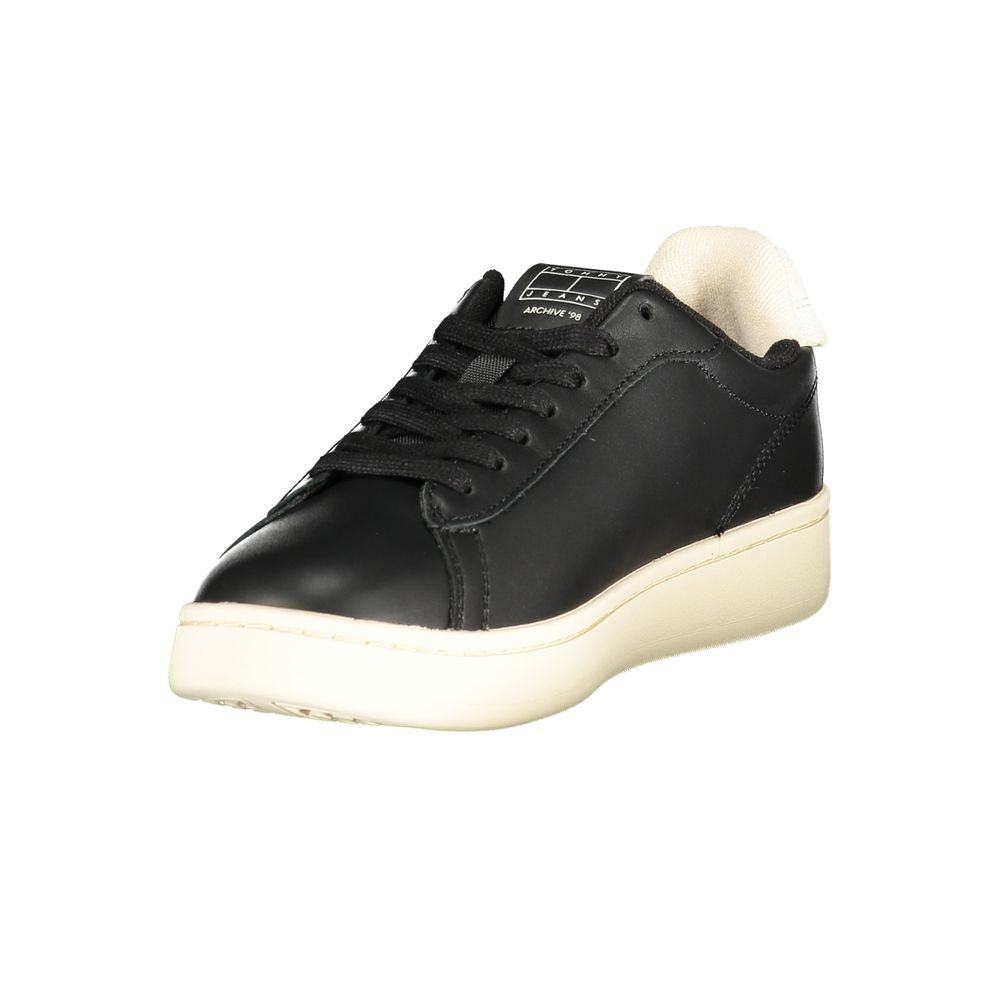 Tommy Hilfiger black polyester low-top sneakers with a cream-colored midsole and matching cushioned heel collar.