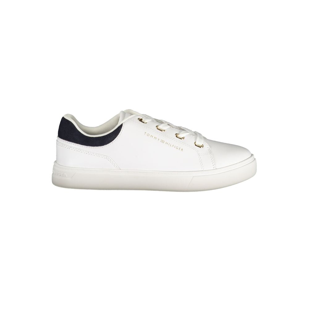 White polyurethane women’s lace-up sneaker with navy blue heel patch and gold eyelets by Tommy Hilfiger.