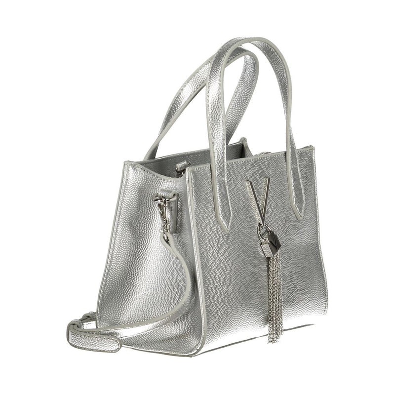 Silver polyurethane textured tote bag with top handles, crossbody strap, and decorative chain tassel