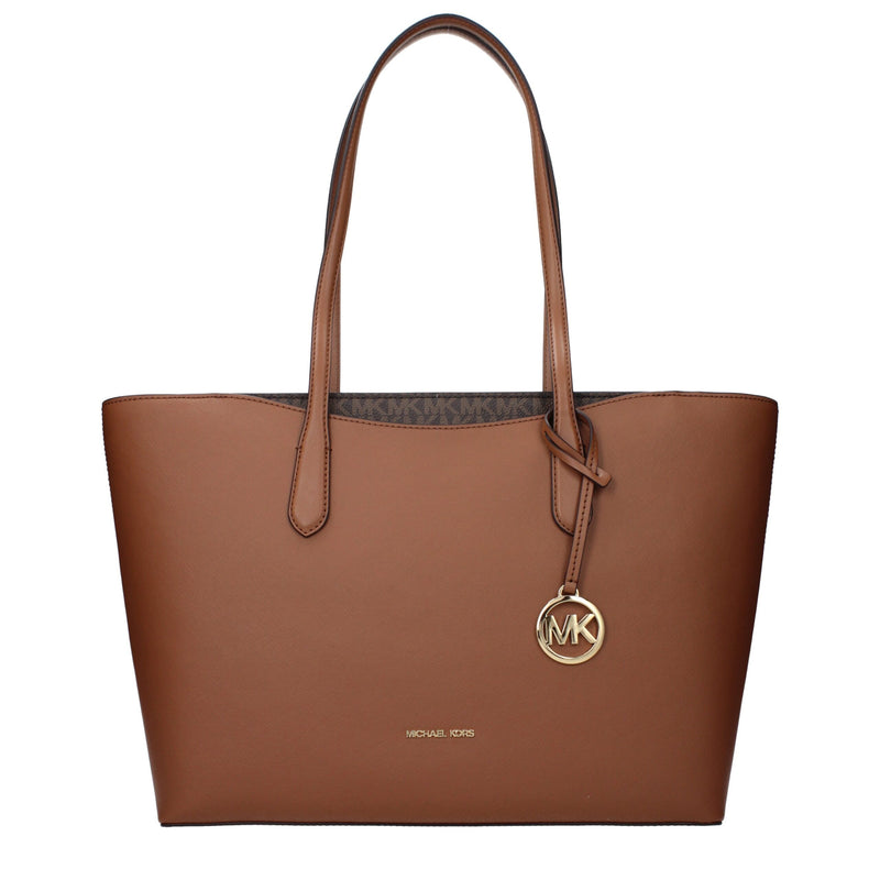 Brown leather shoulder bag with dual straps and gold-tone MK logo charm
