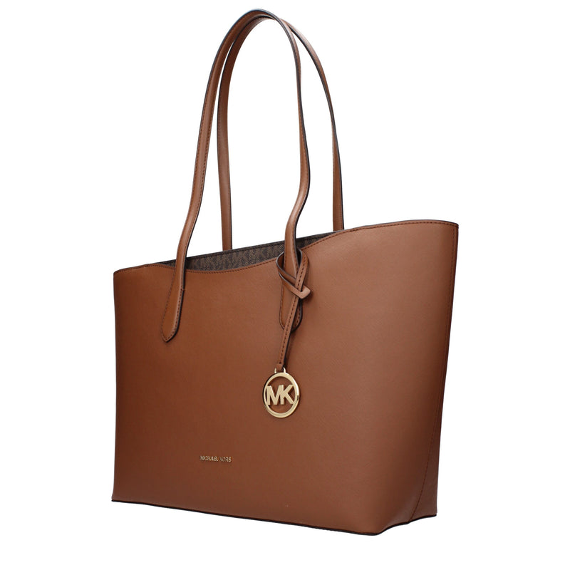 Brown leather Michael Kors shoulder bag with thin straps and a gold MK logo charm