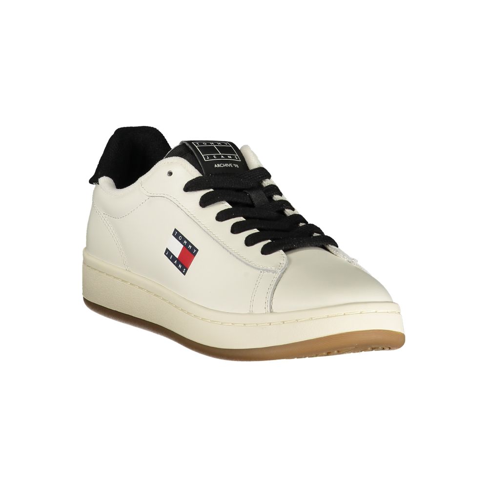White Tommy Hilfiger polyurethane women's sneaker with black laces, tongue detail, and brand logo on the side.