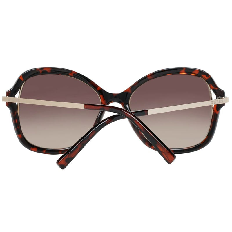 Guess brown tortoiseshell plastic and gold metal sunglasses with gradient lenses