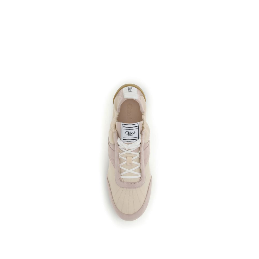 Beige nylon and suede athletic sneakers with white laces, a Chloé logo tongue label, and a rubber sole.