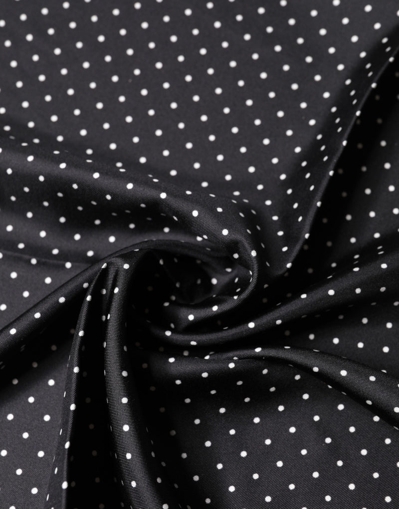 Black silk square foulard scarf with white polka dots draped softly